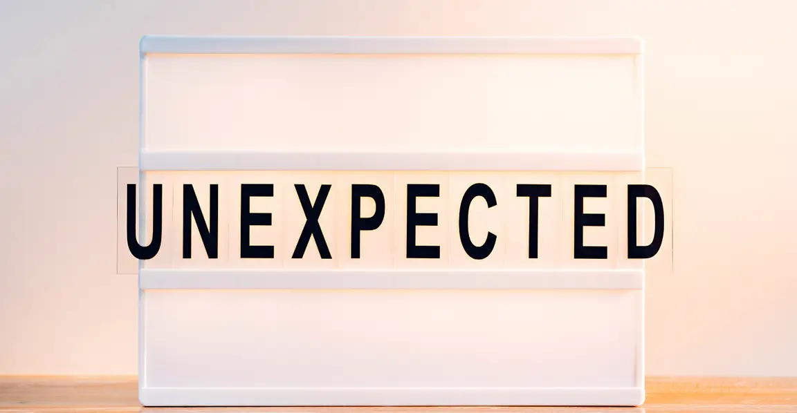 a sign that reads unexpected
