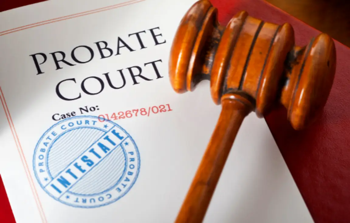 court gavel laying on top of a probate court document