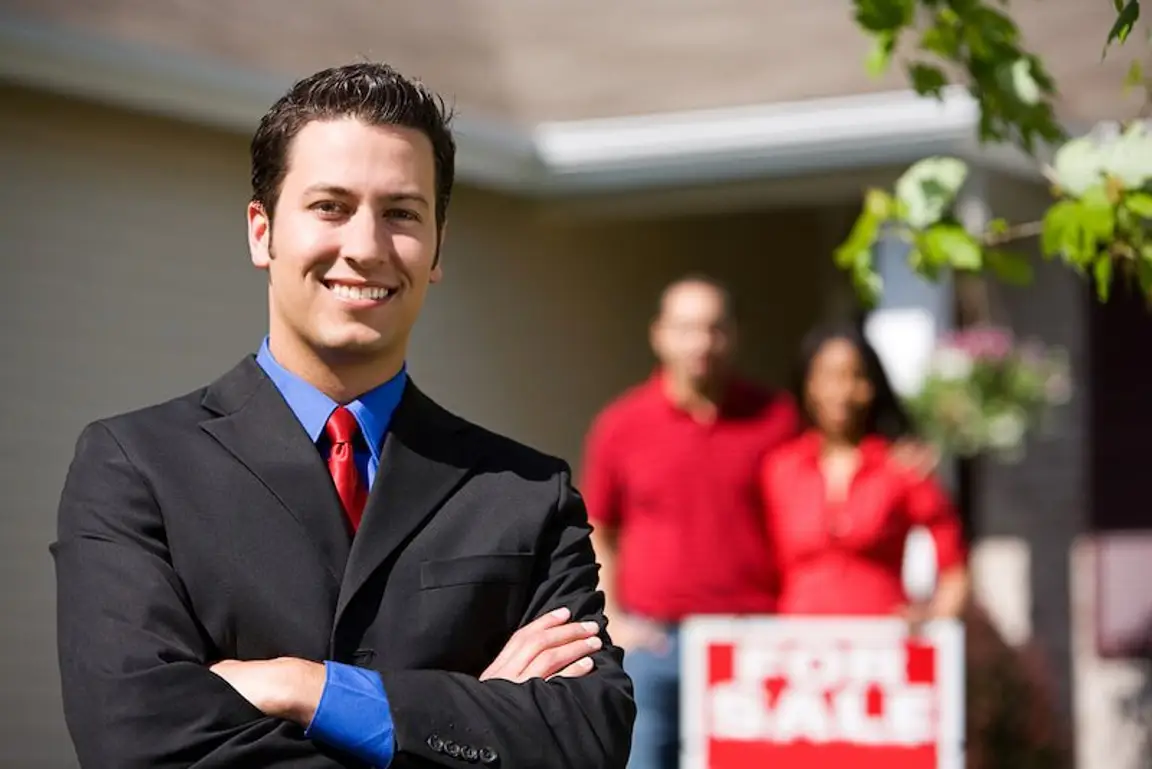 couple listing their home with a real estate agent