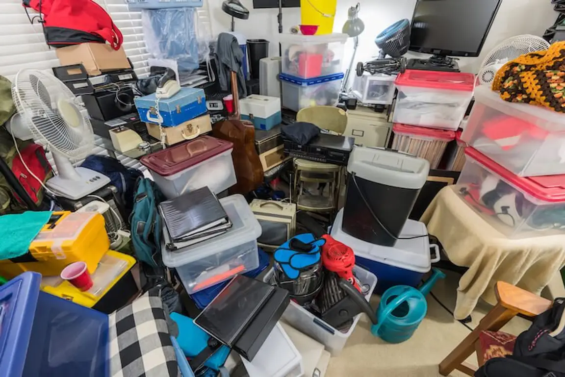 a pile of different stuff at a hoarders house in Memphis