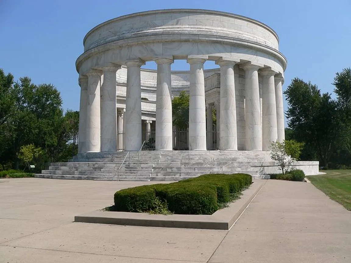 President Warren G. Harding Memorial, Marion, Ohio photo - The Harding Tomb is a circular monument of white Georgia marble furnished by the Georgia Marble Company of Tate, Georgia, and contains the remains of President and Mrs. Harding. The monument, set in 10 acres of landscaped grounds, is similar in appearance to a round Greek temple | We Buy Houses Marion OH | Homesmith Buys Houses Marion OH