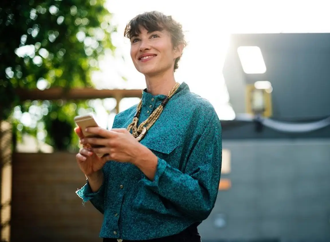 Types of Loans - picture of happy girl on iphone - we buy nky houses