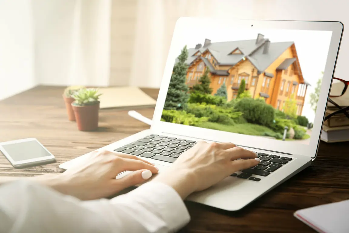 Woman using technology to buy a house