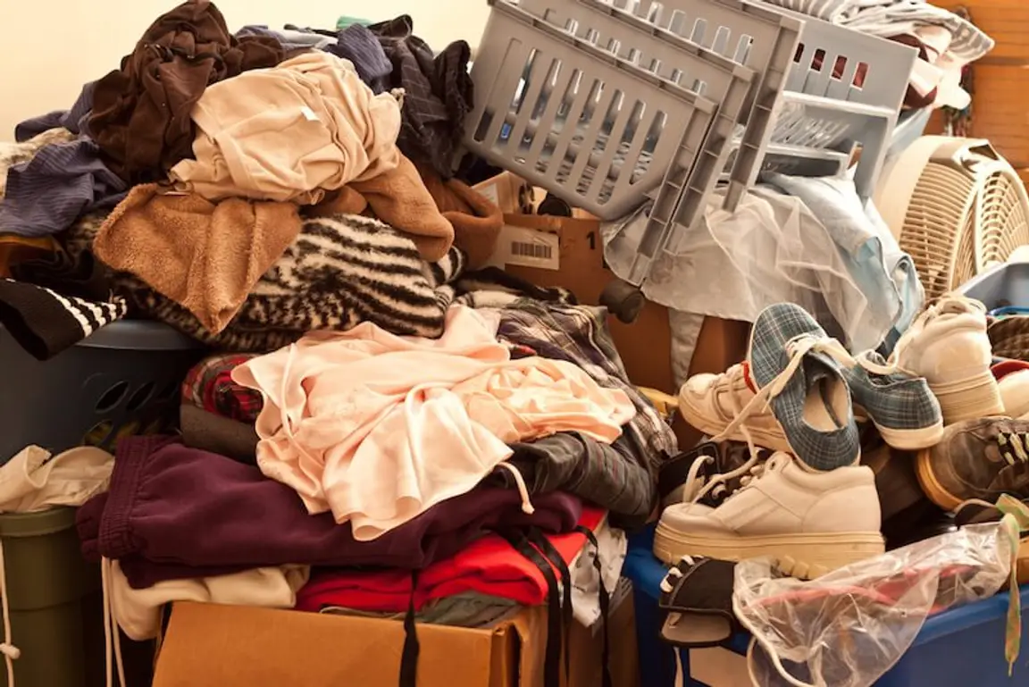pile of clothes in a hoarder house