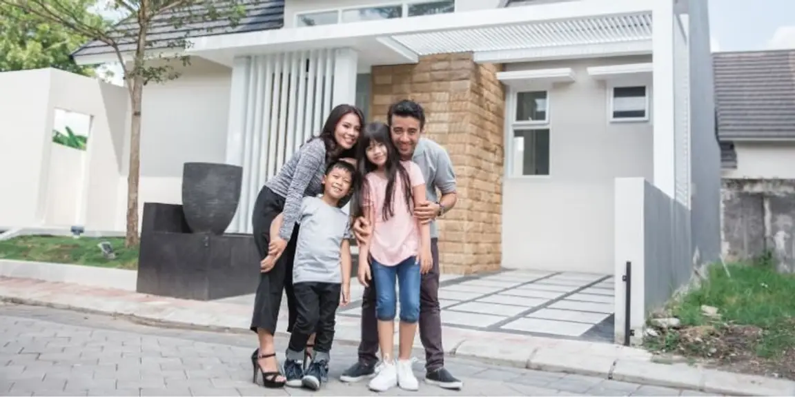 Family in Front of a House