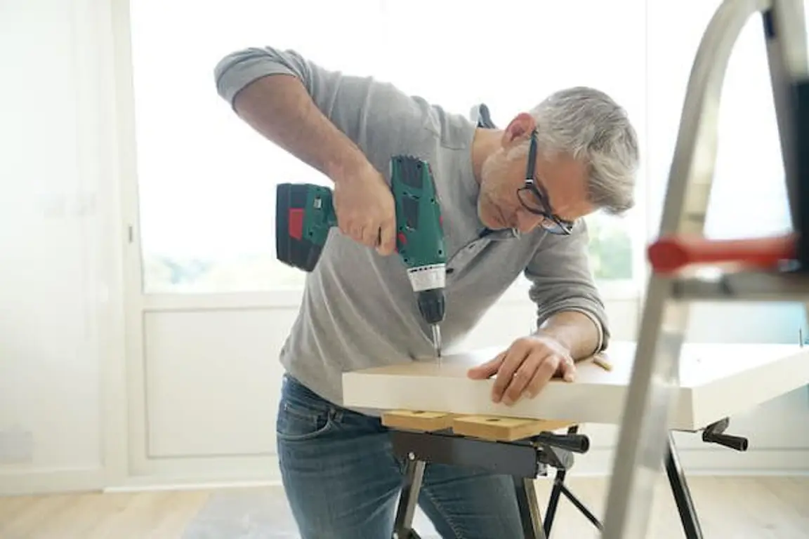 Man Repairing to Sell an Old Home
