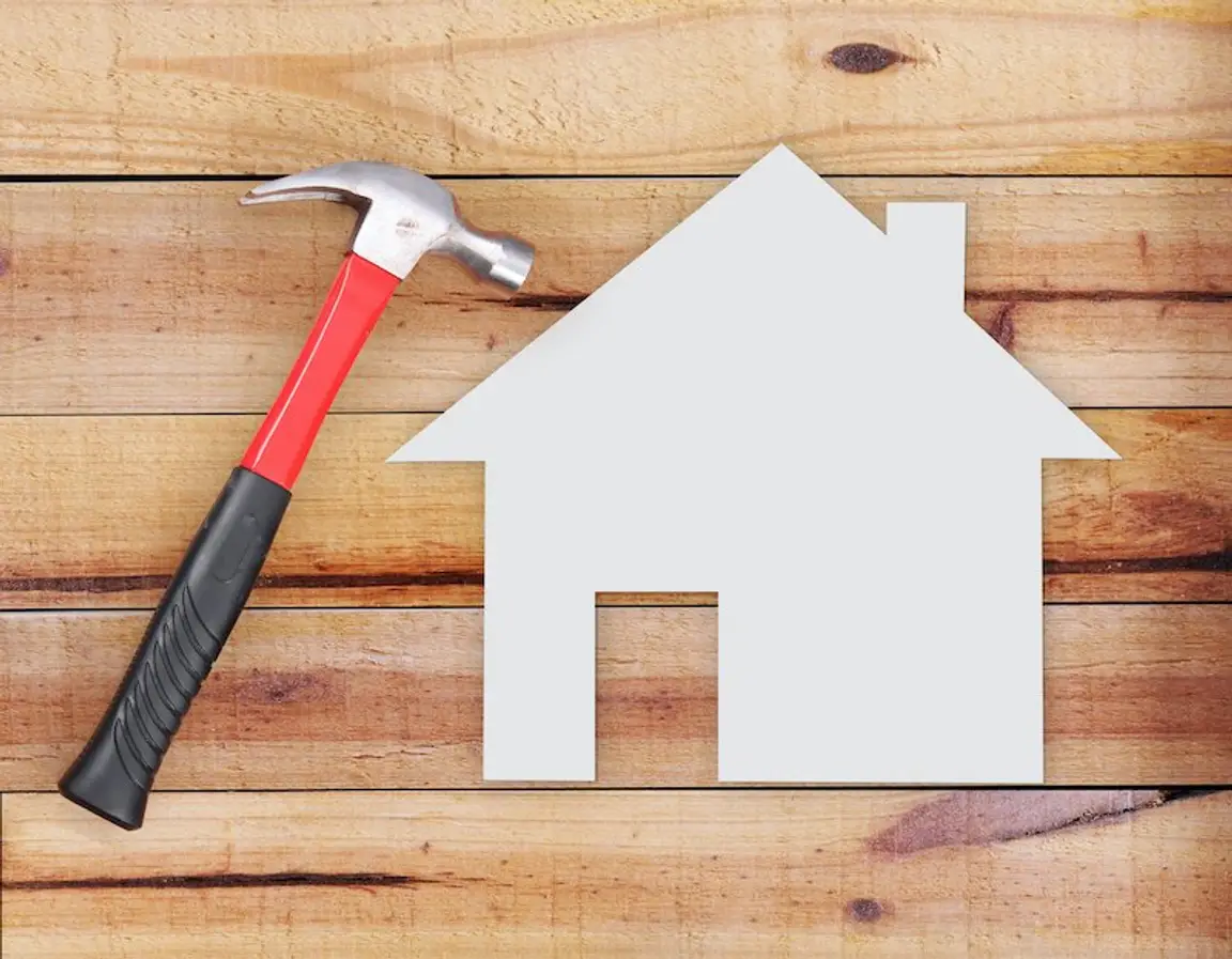 hammer and a house-shaped cut out