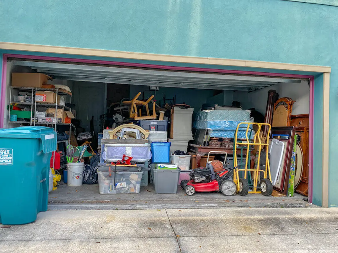 a hoarders garage filled with many unorganized stuff