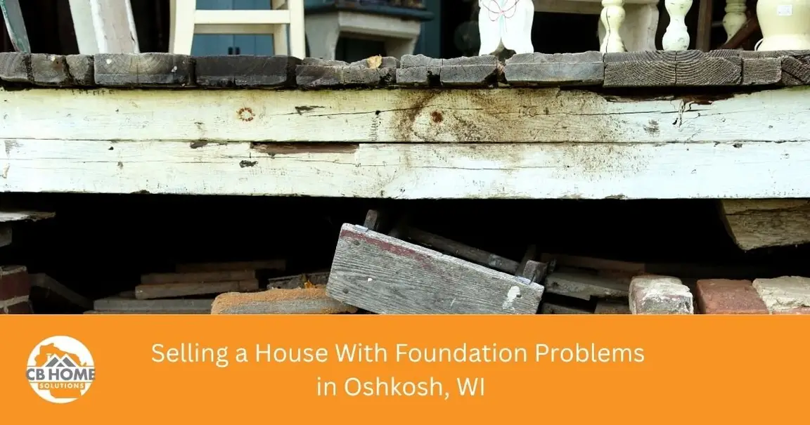 Cracked stone basement wall in an older Oshkosh home with foundation problems
