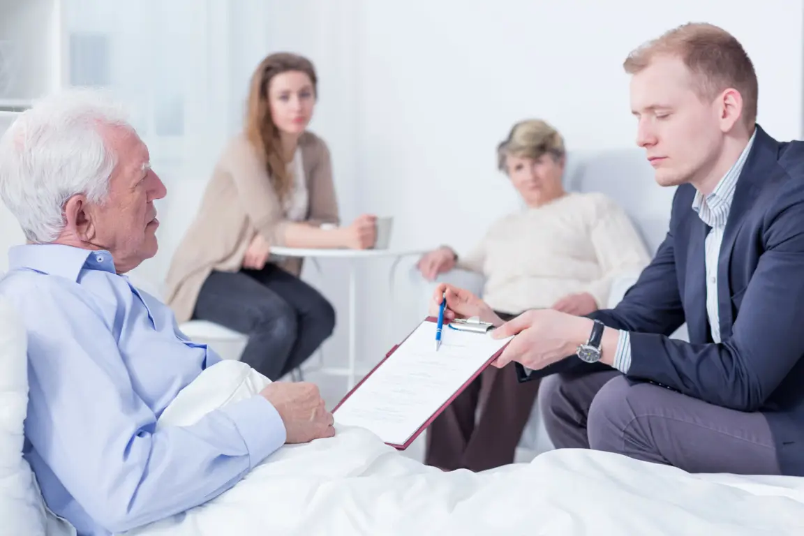 older man reviewing his will with an attorney