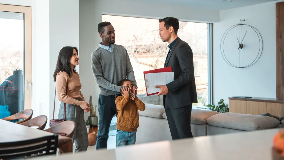 A family talking to a real estate agent
