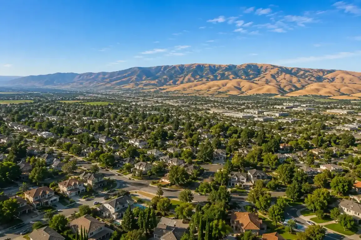 Aerial hero image of Livermore CA neighborhoods with the Altamont Pass hills in the background for a sell my house fast cash home buyers