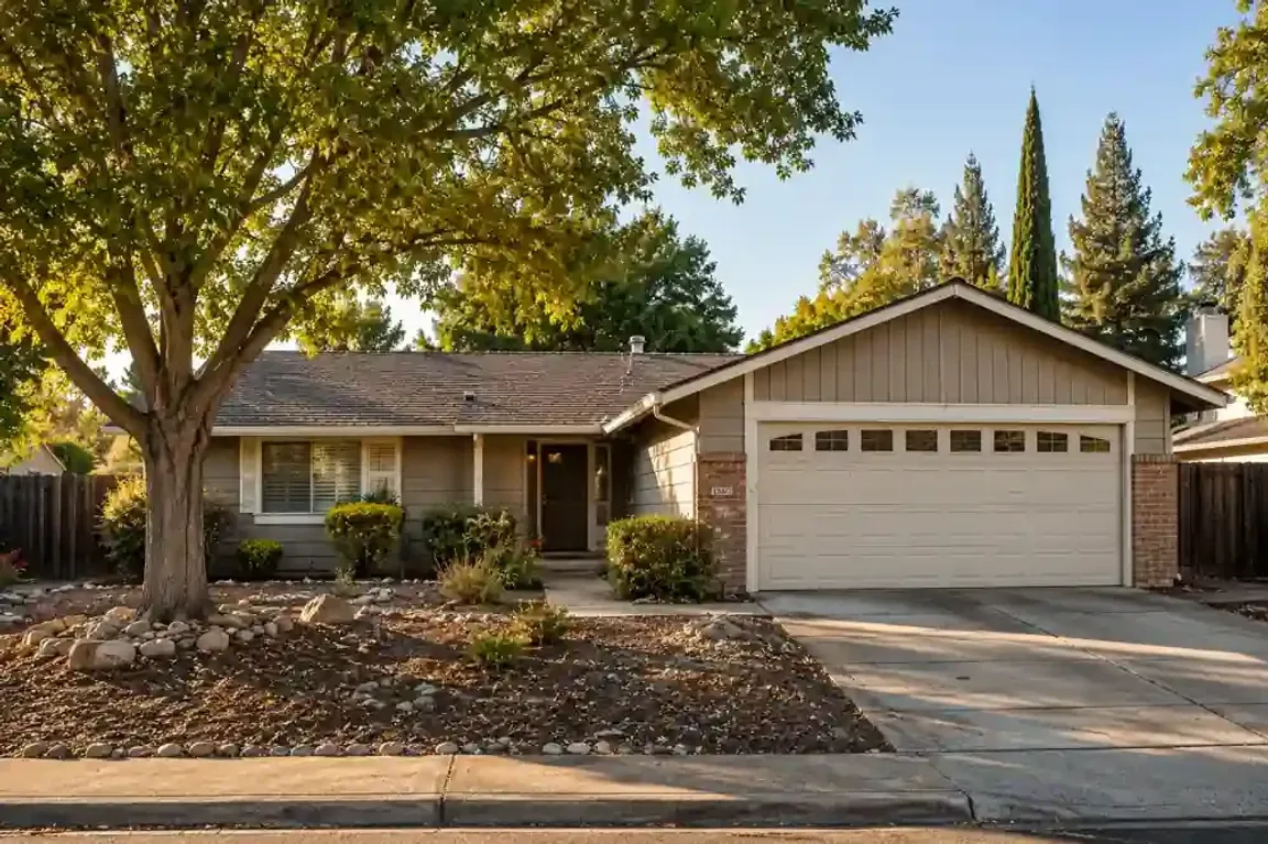 Sell my house fast in Roseville CA with a local cash home buyer standing outside a dated ranch style home in a quiet Roseville neighborhood.