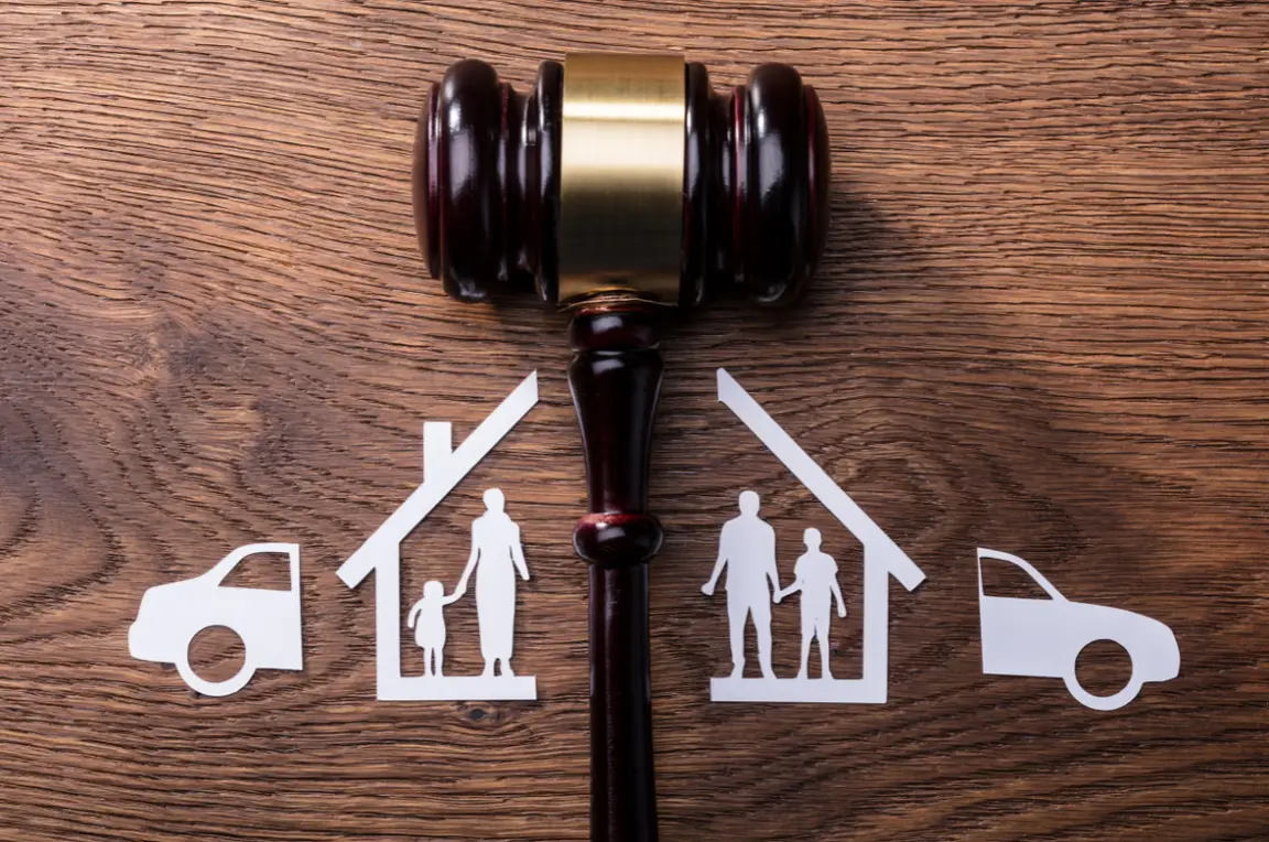 A gavel dividing silhouettes of a couple with their children, house, and car.