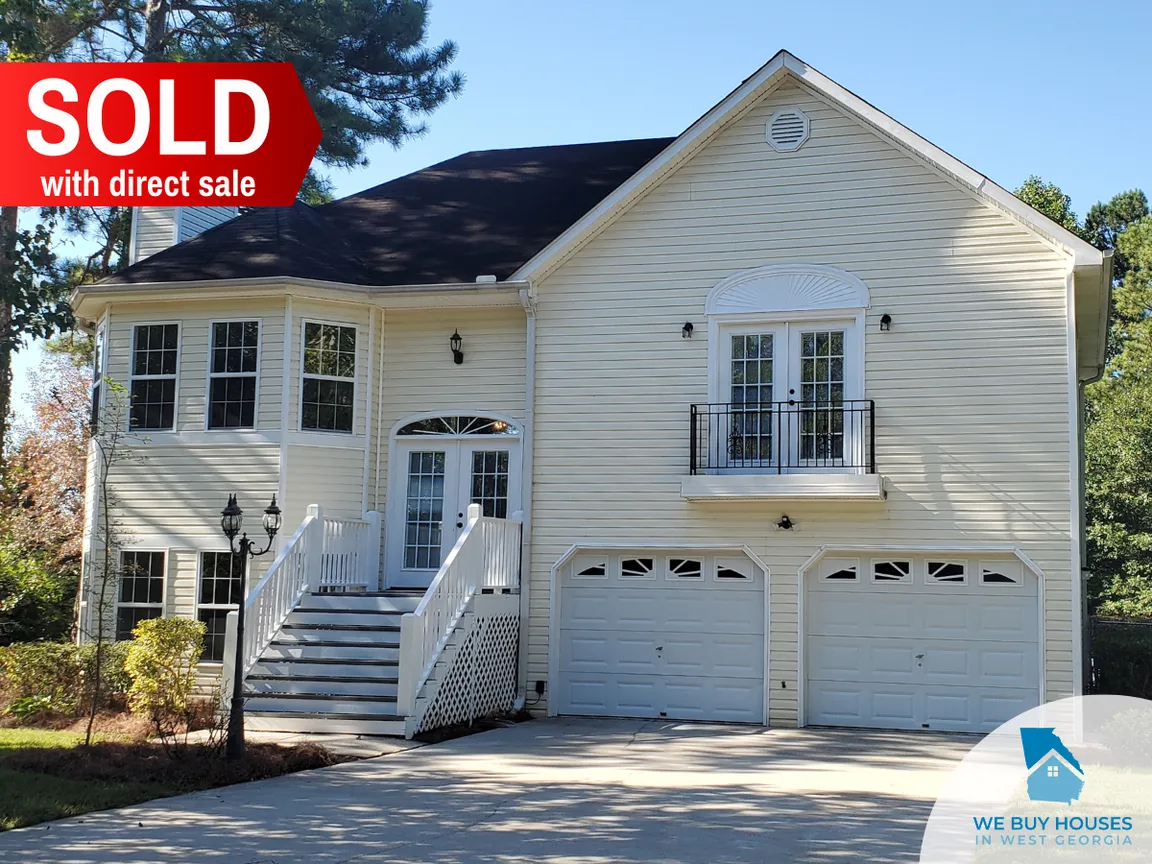 A white two-story house purchased through direct sale by We Buy Houses in West Georgia
