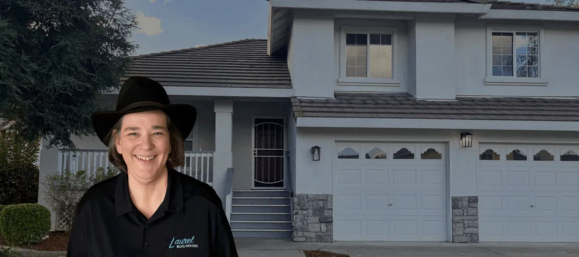 Laurel Buys Houses | Laurel Sagen pictured in front of a charming, two story home with a red door.