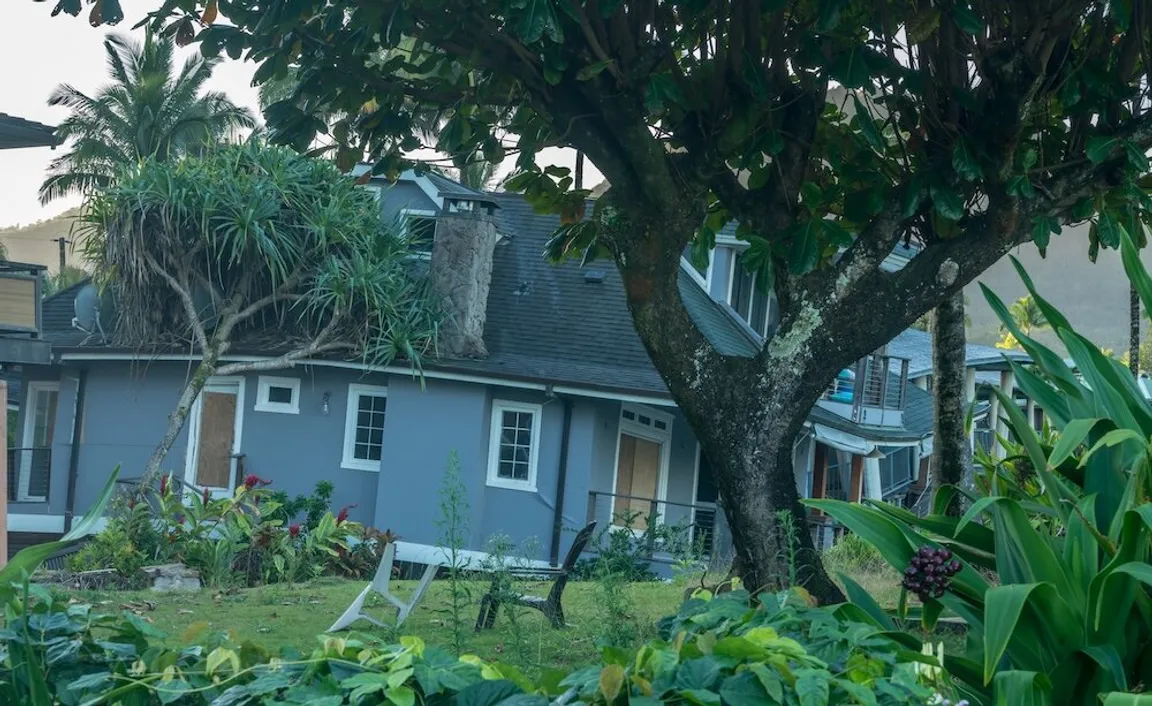 House tipping into sinkhole