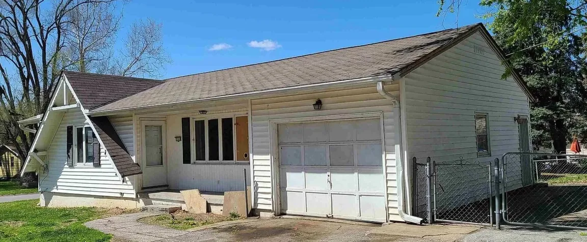 Exterior view of a house in Omaha, NE that needs repairs.