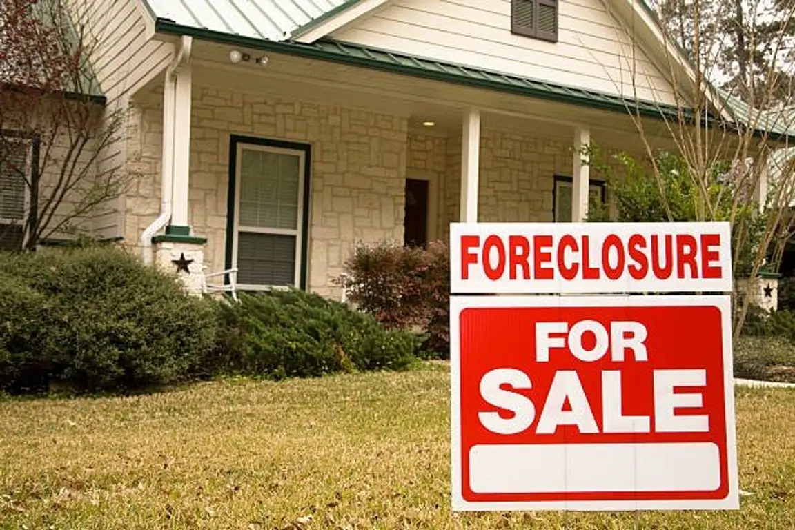 A Foreclosure Signage in Front of a House | Avoid Foreclosure