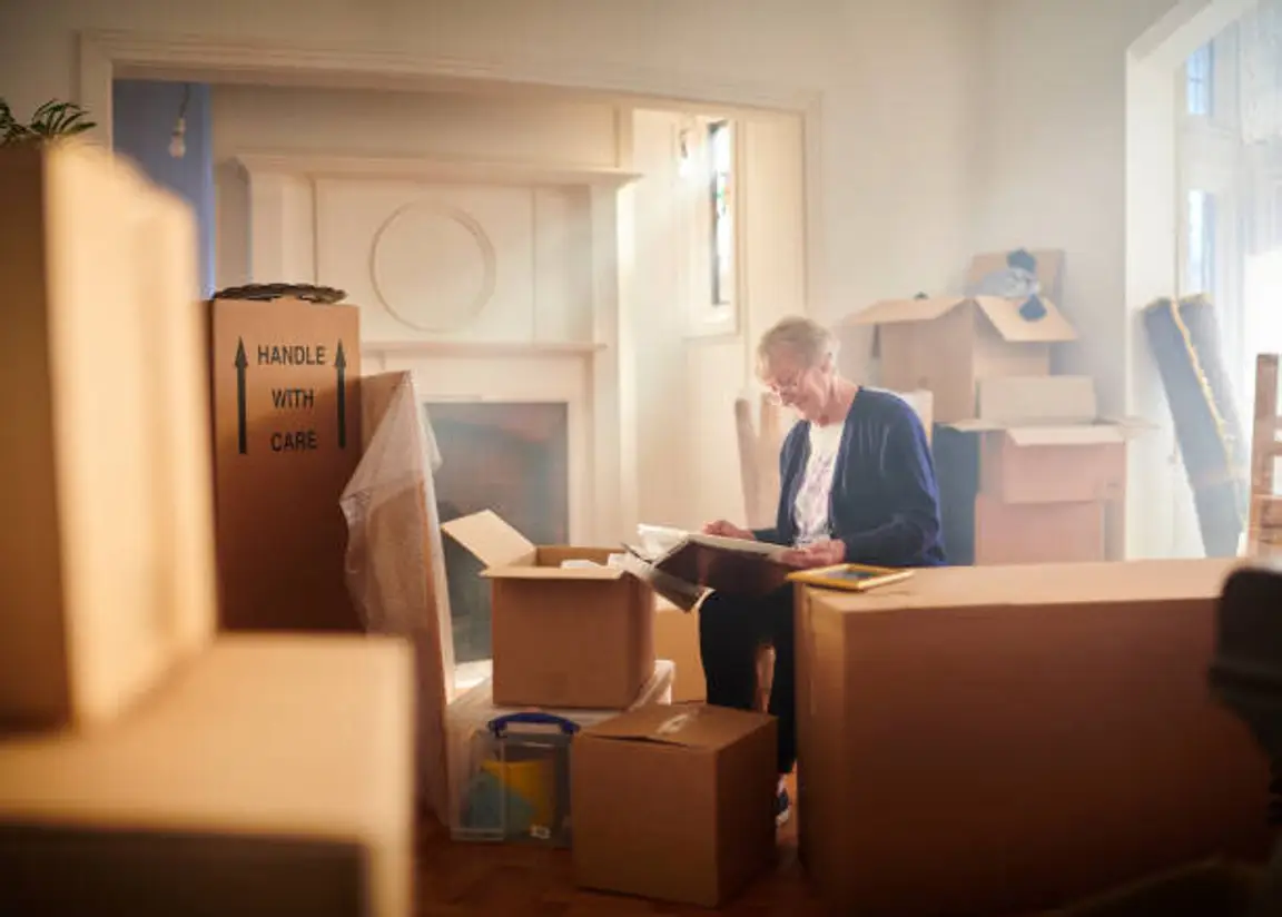 An Elderly Woman Packing Items | Tips for Downsizing