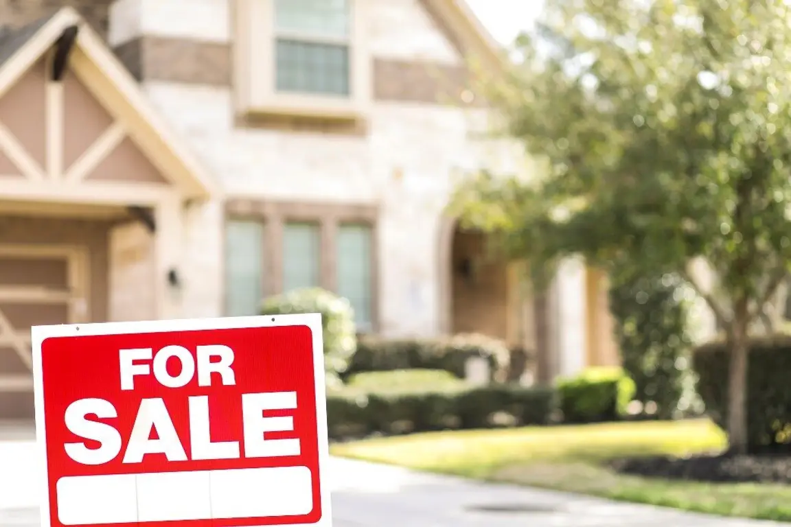 A “For Sale” Sign in Front of a House | Selling a House As Is