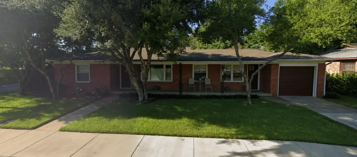 Front exterior of Oak Summit Group home office in Westworth Village, Texas with brick facade, front porch, and shaded lawn in a quiet residential neighborhood