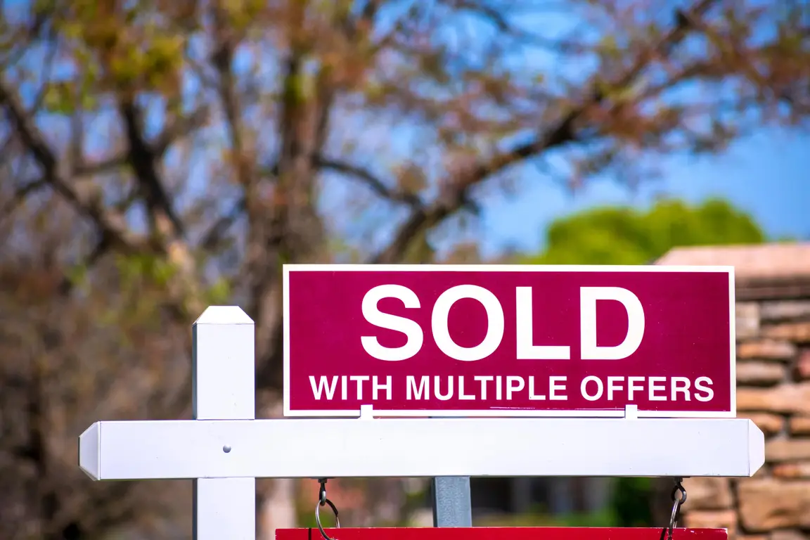 Sold Sign Showing Multiple Offers in Hot Real Estate Market