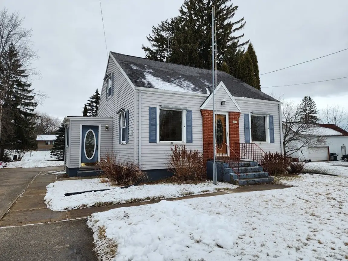 Snow-covered Cleveland home illustrating traditional sales, short sales, and foreclosures