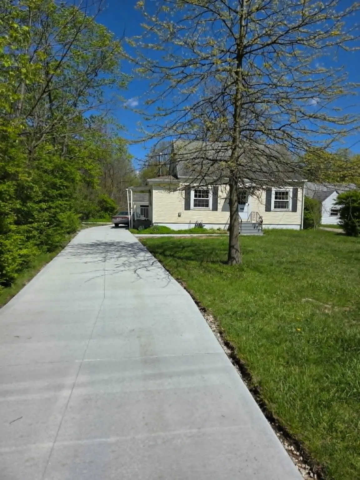 The Oakwood Village property after major cleanup and exterior improvements. The street address is intentionally omitted.