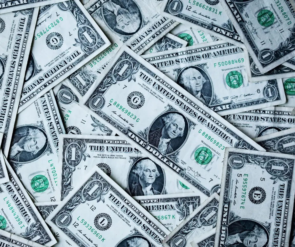 pile of one-dollar bills