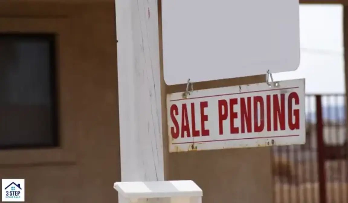 Home with a sale pending sign.