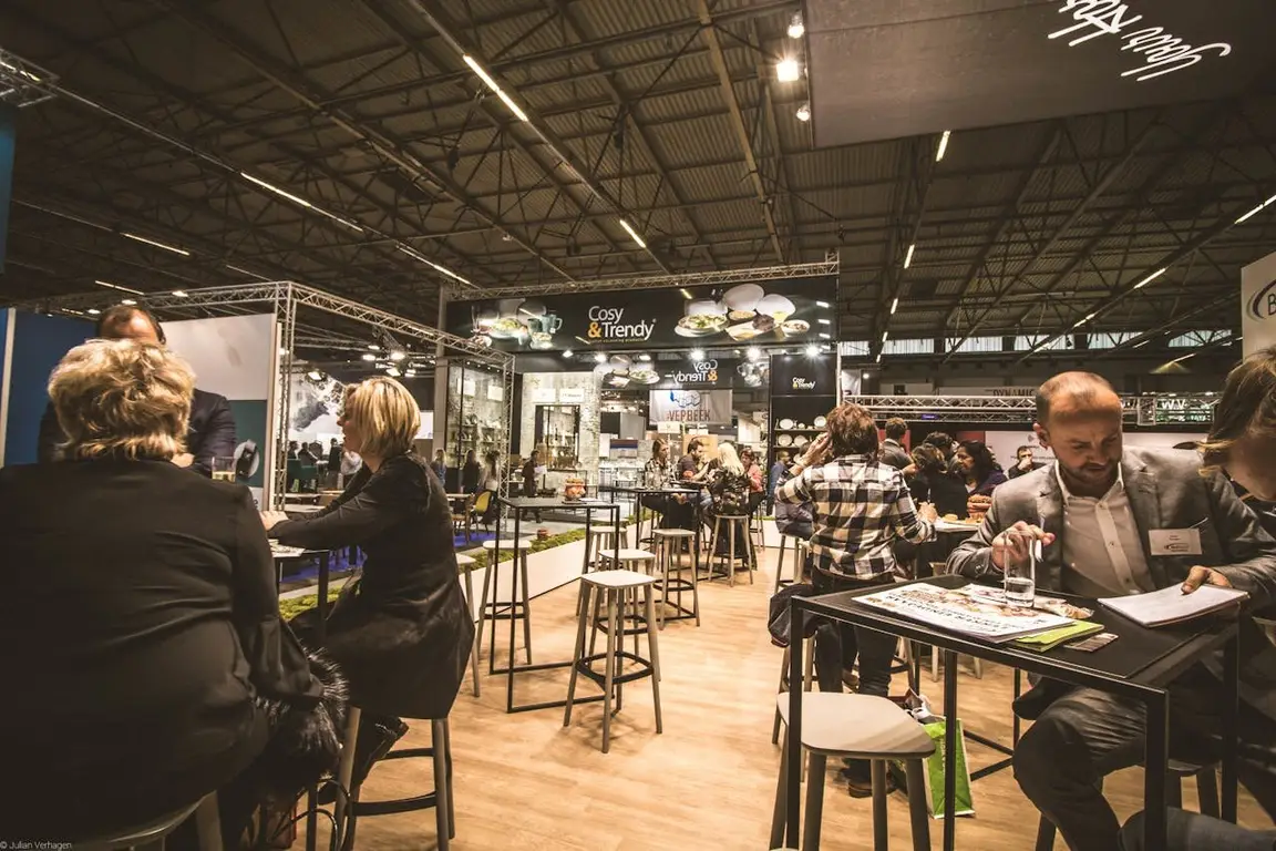 People at a work event as networking can help you sell your home