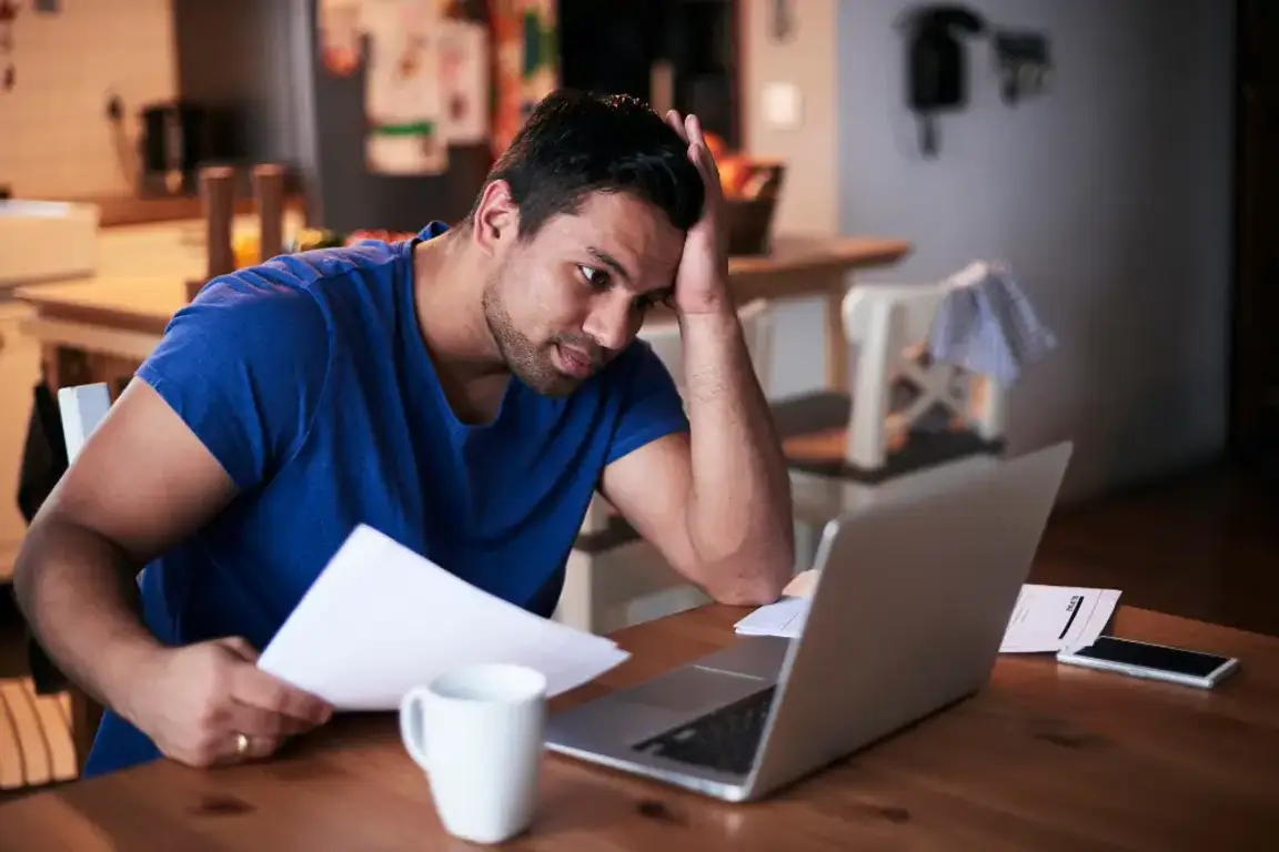 Man having a problem in front of laptop