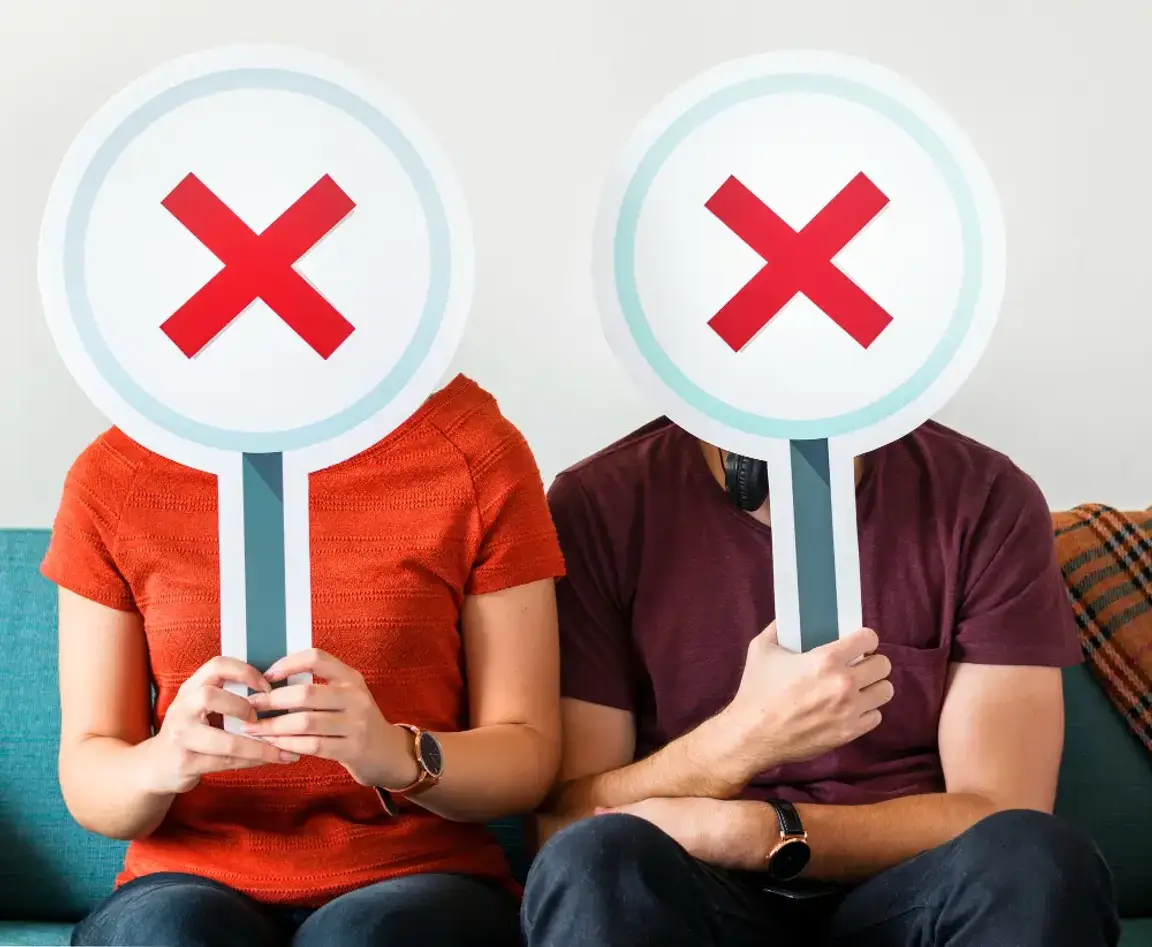 Man and woman with X as faces
