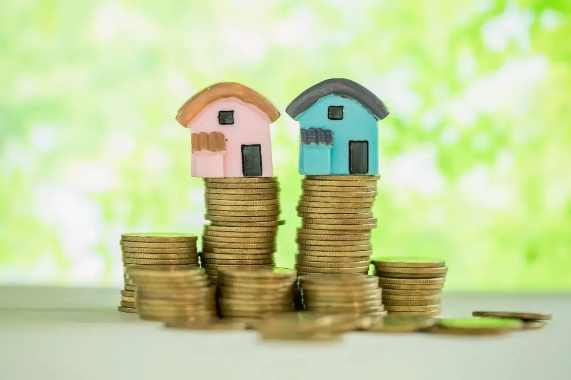 House on top of a stack of coins