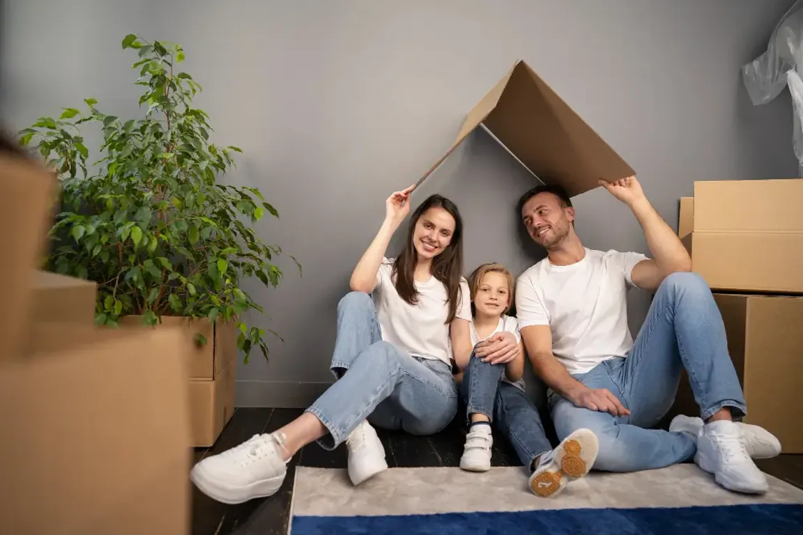 Family under a cardboard roof
