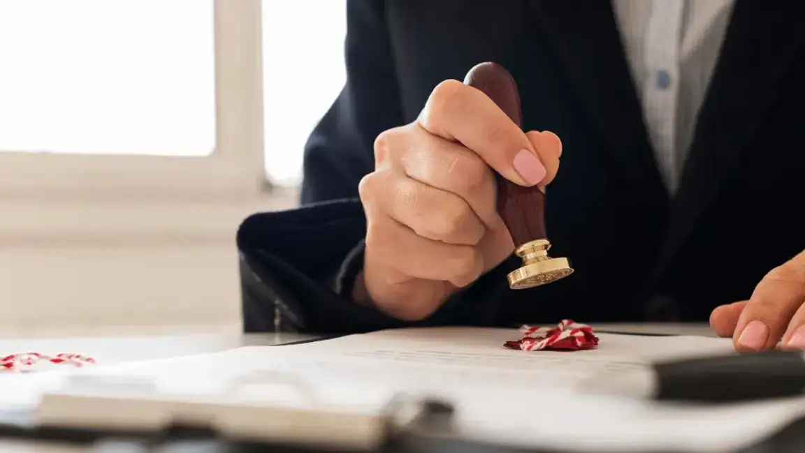 Man stamping on a paper