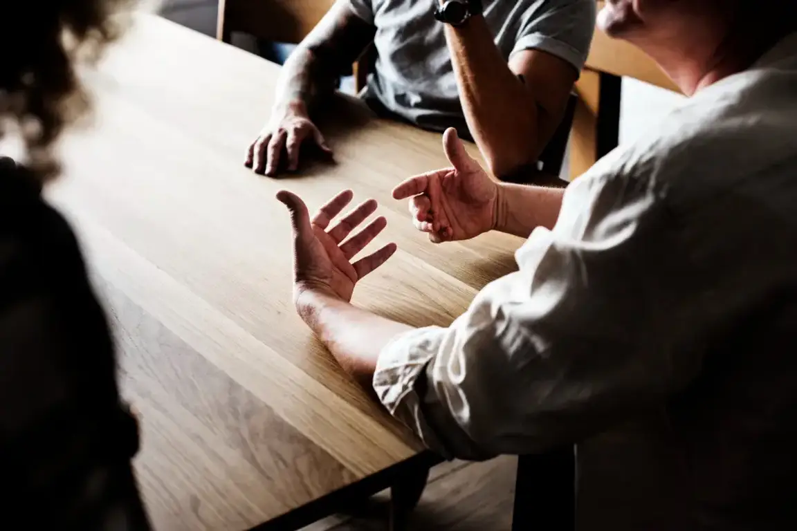 A group of men having a conversation