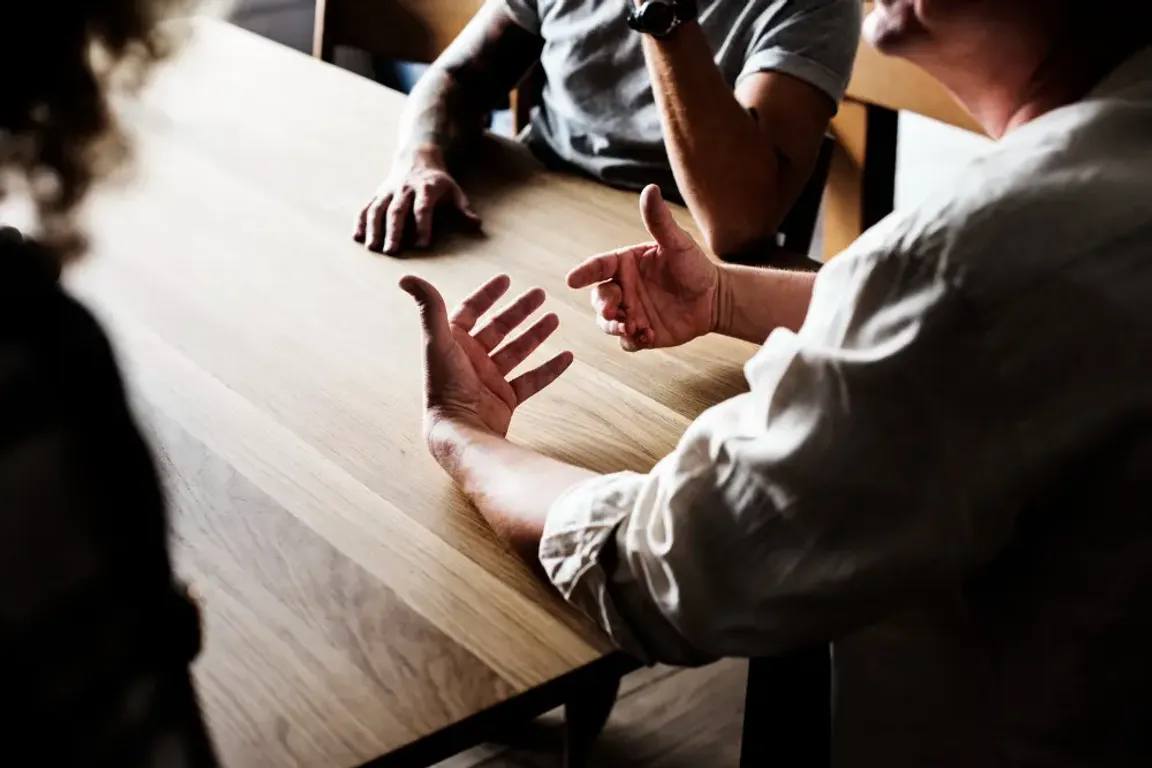 A group of men having a conversation