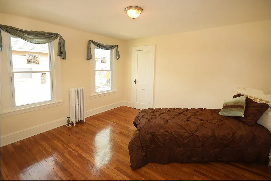 Bedroom by NoCo House Buyers Inc
