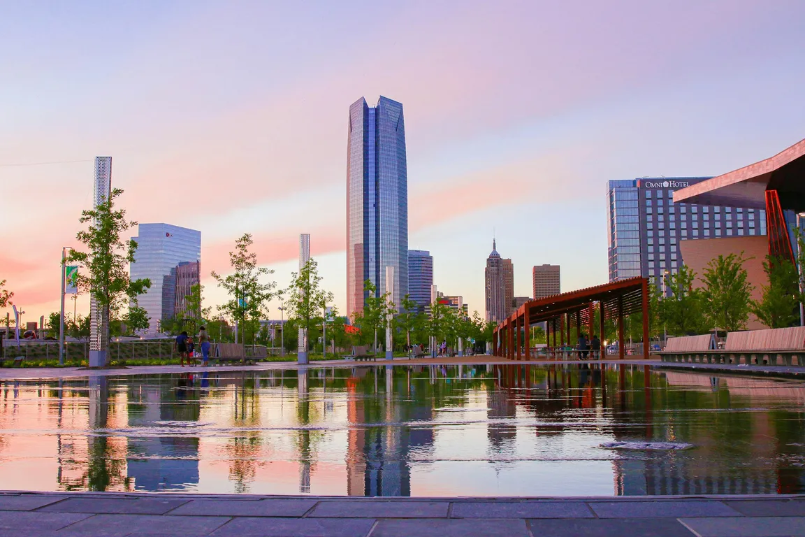Downtown Oklahoma City skyline with Devon Tower reflected in Scissortail Park