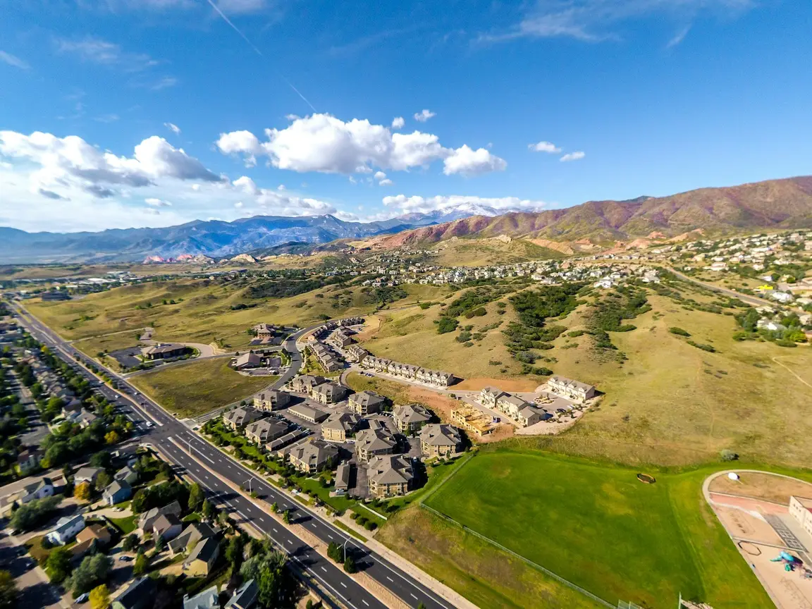 Aerial view of houses with a mountain behind