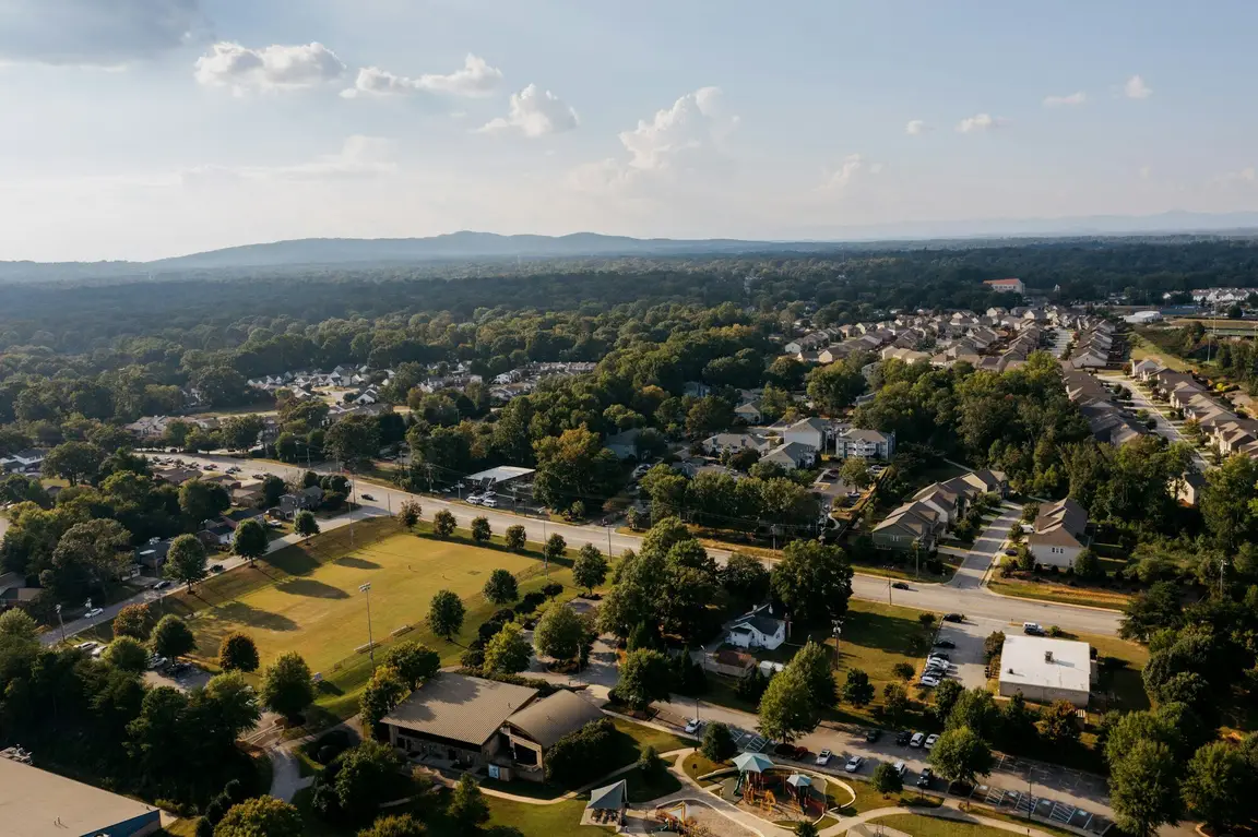 Aerial view of a residential neighborhood with mountains on the horizon