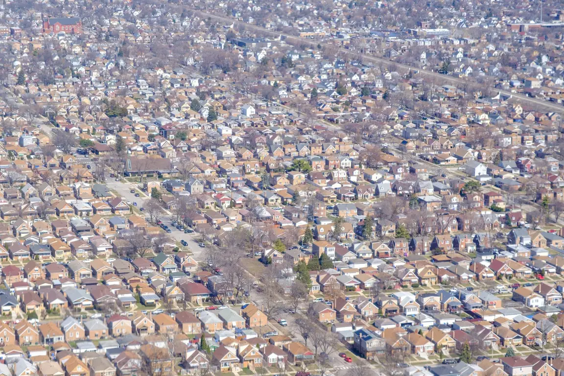 Aerial view of a dense residential neighborhood of small detached houses