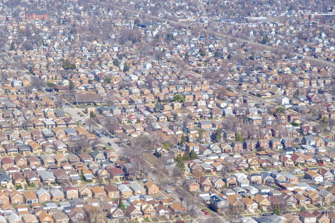 Aerial view of a dense residential neighborhood of small detached houses