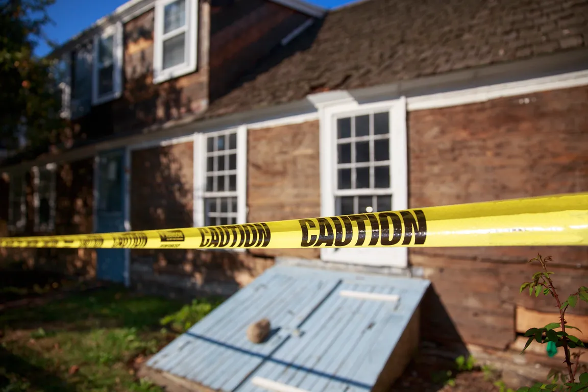 House with code violations - caution tape on property