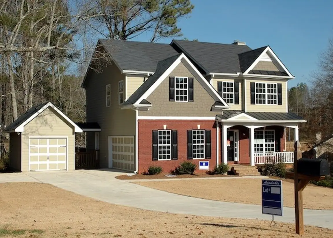Brick house with blue shutters for sale in Raleigh north carolina.