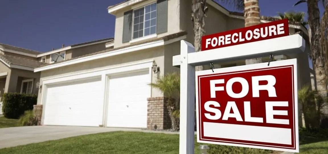 A ray of hope shining on a Pompano Beach home under the shadow of foreclosure, symbolizing prevention measures.