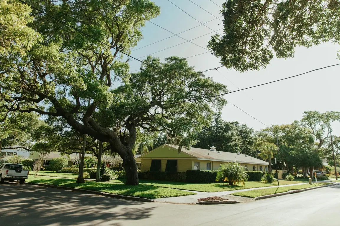 Ranch-style home under oak trees in Dunnellon, FL