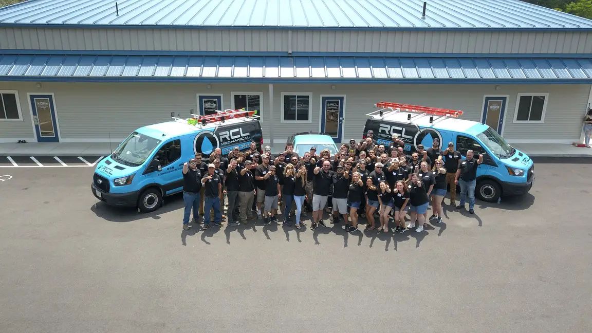 RCL Team in front of office with trucks